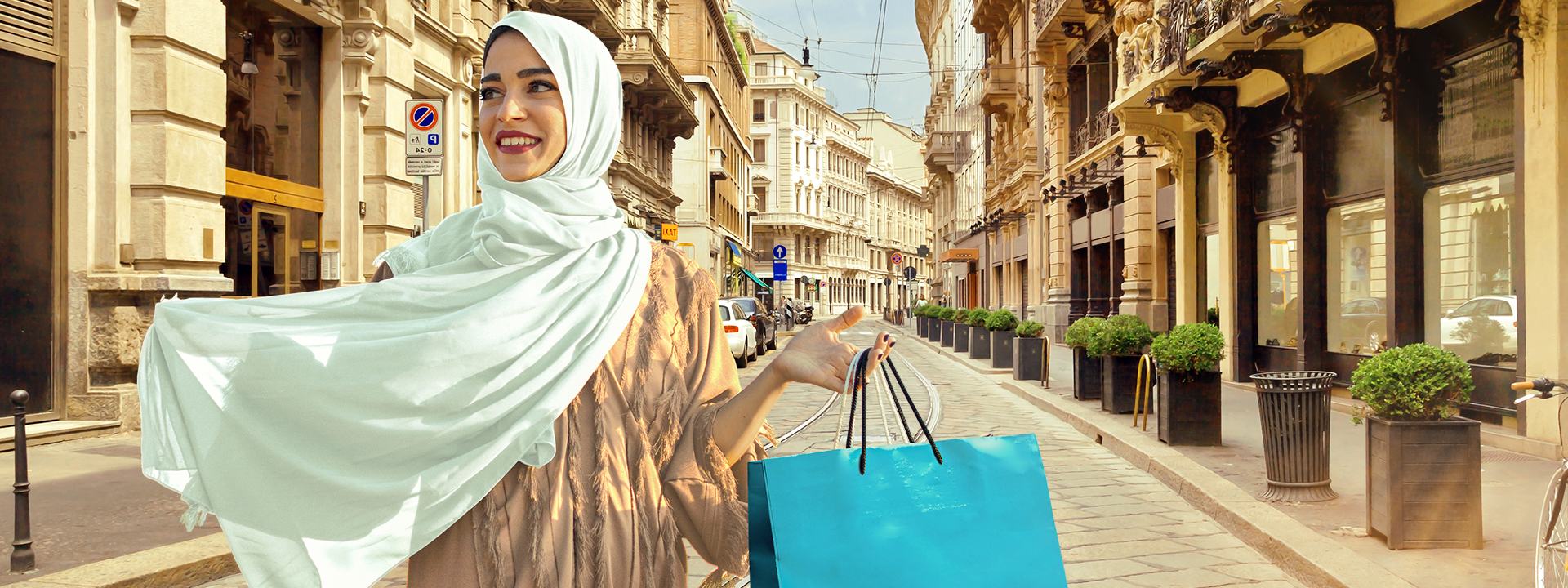 A woman in a sheila with shopping bags