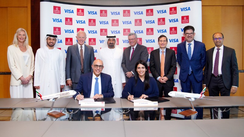 Emirates Skyward and Visa signing documents