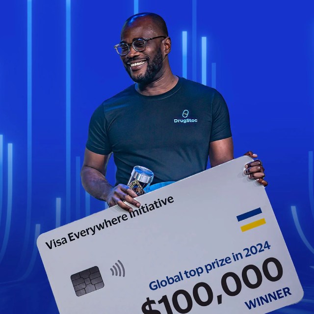 A man with a Visa Everiwhere Initiative winner certificate